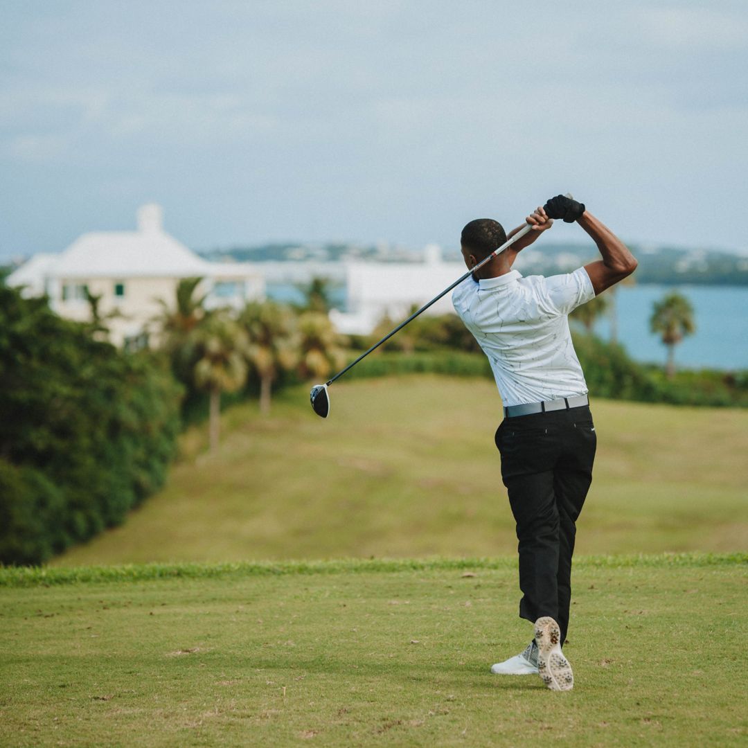 Golfer hitting down the fairway